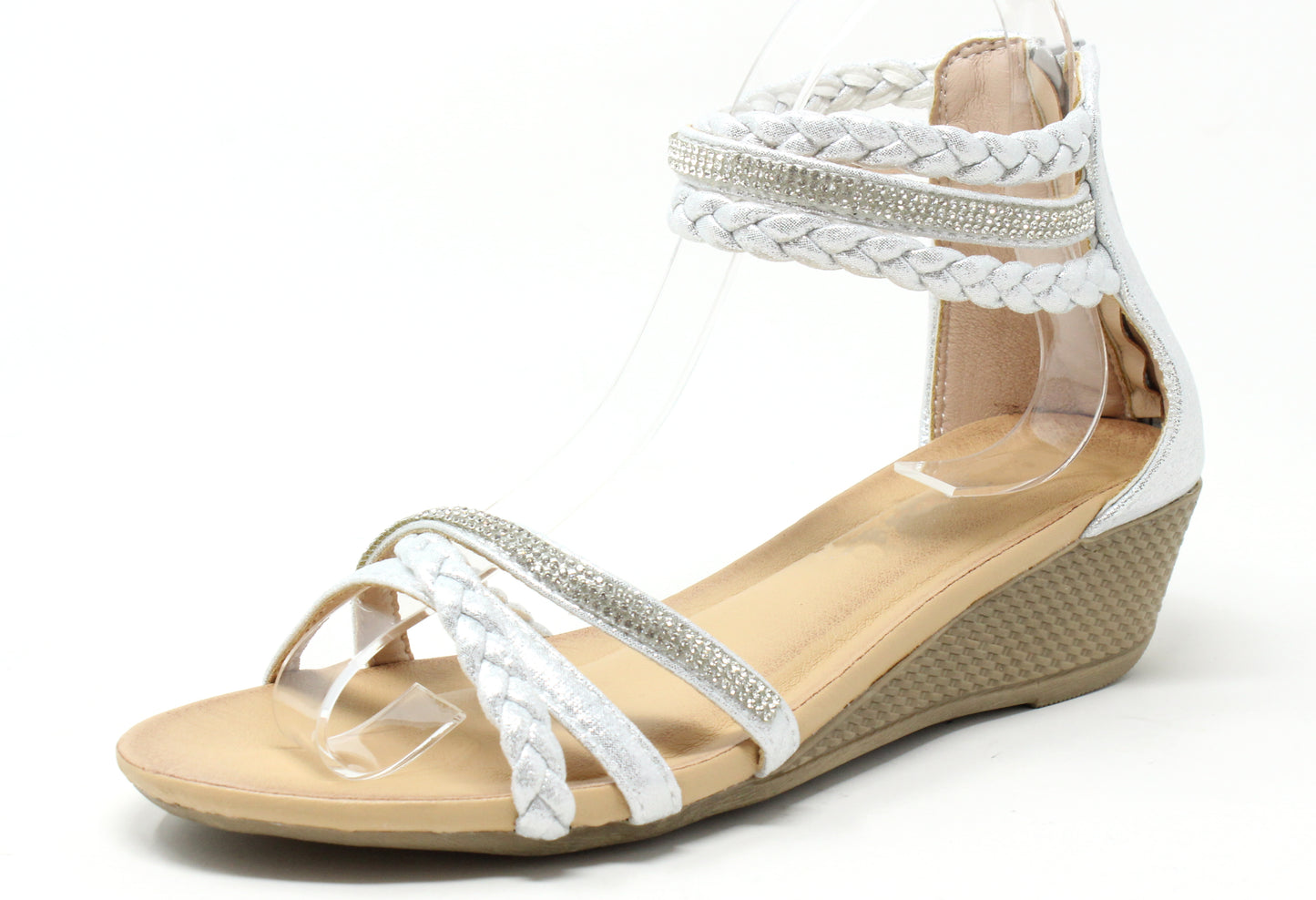 Beige wedge sandal with white braided straps on a white background