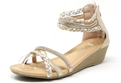 Beige wedge sandal with braided straps on a white background