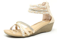 Beige wedge sandal with braided straps and rhinestones on a white background