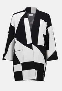 Black and white geometric patterned jacket on a white background