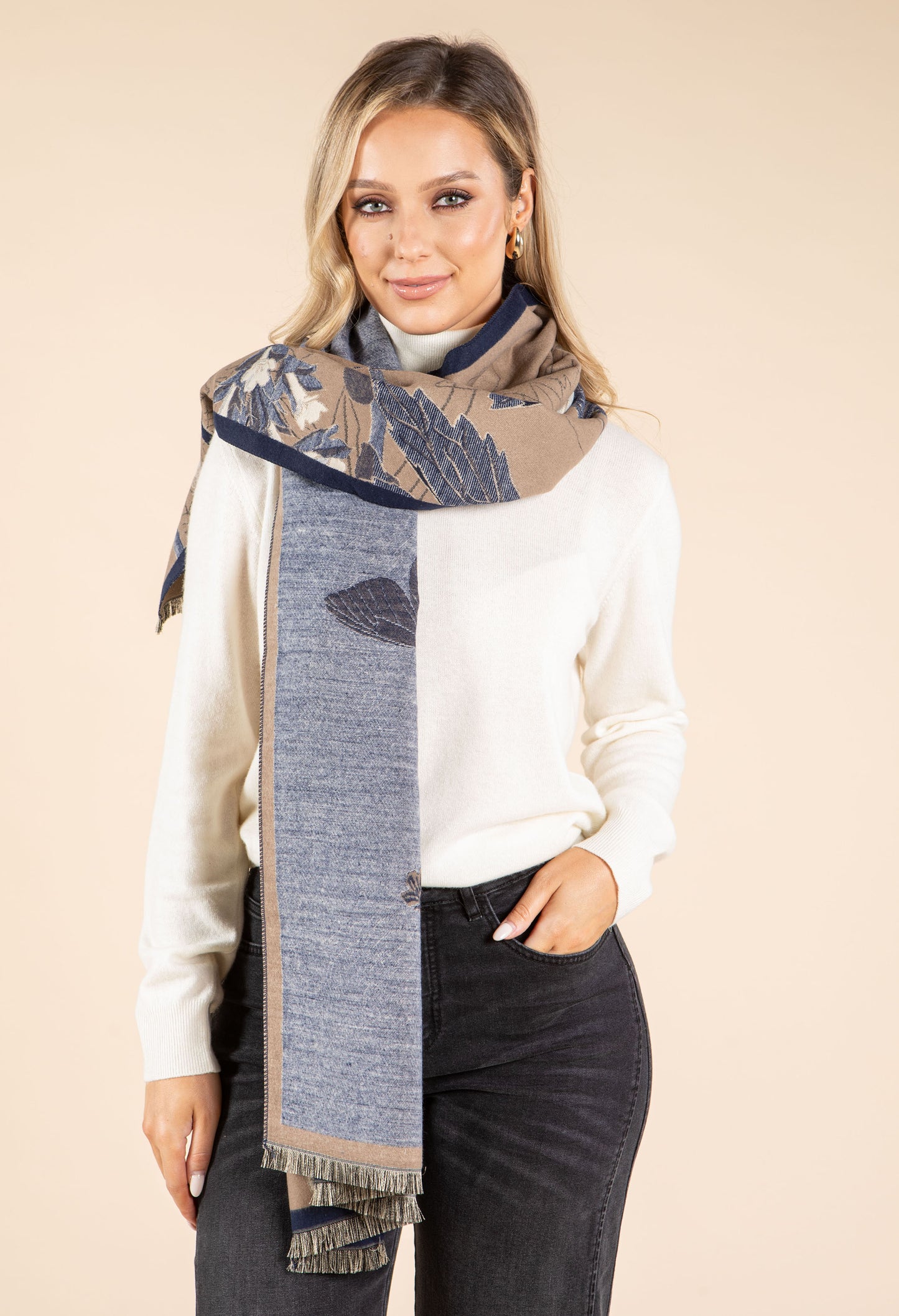 Woman wearing a patterned scarf with a neutral background