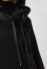 Black hoodie with textured collar on a white background