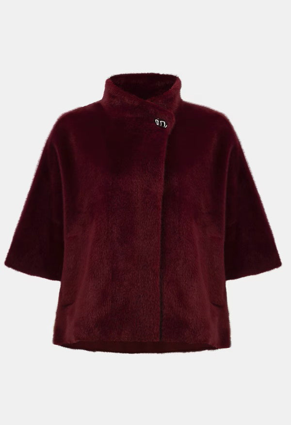 Burgundy fleece poncho on a white background