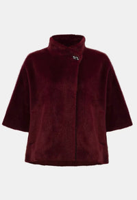 Burgundy fleece poncho on a white background