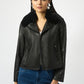 Woman wearing a black leather jacket with fur collar on a white background