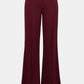 Maroon wide-leg pants on a light gray background