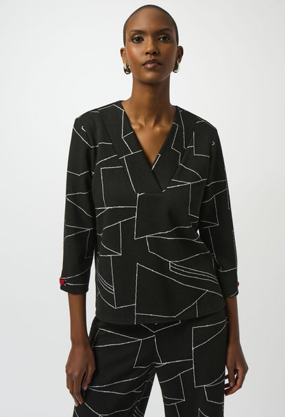 Woman wearing a black geometric patterned outfit on a white background