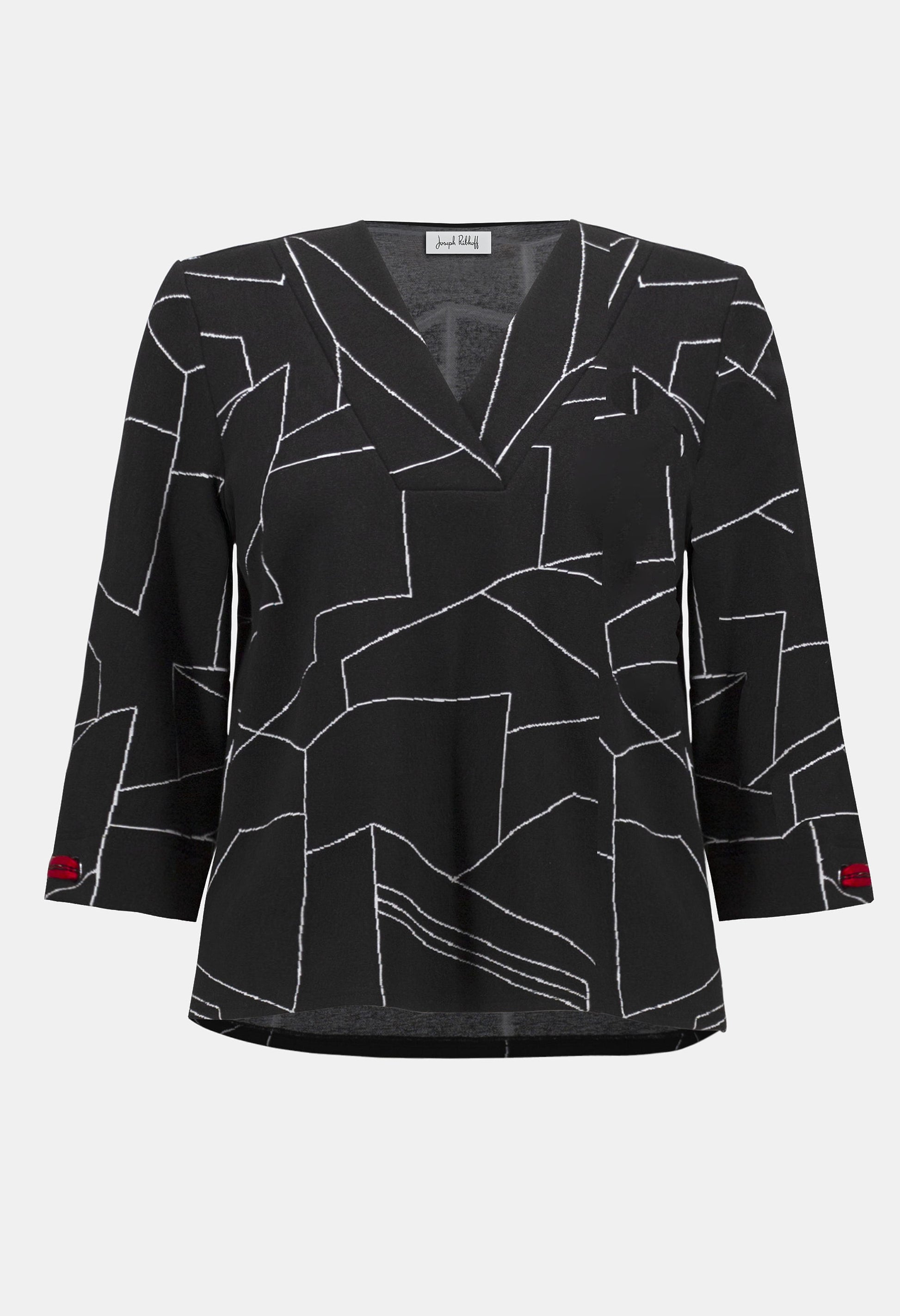 Black blouse with white geometric pattern on a white background