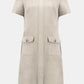 Beige dress with short sleeves and two front pockets on a white background