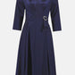 Navy blue dress with a belt on a white background