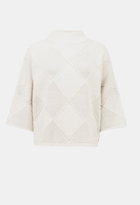 Beige quilted jacket on a white background