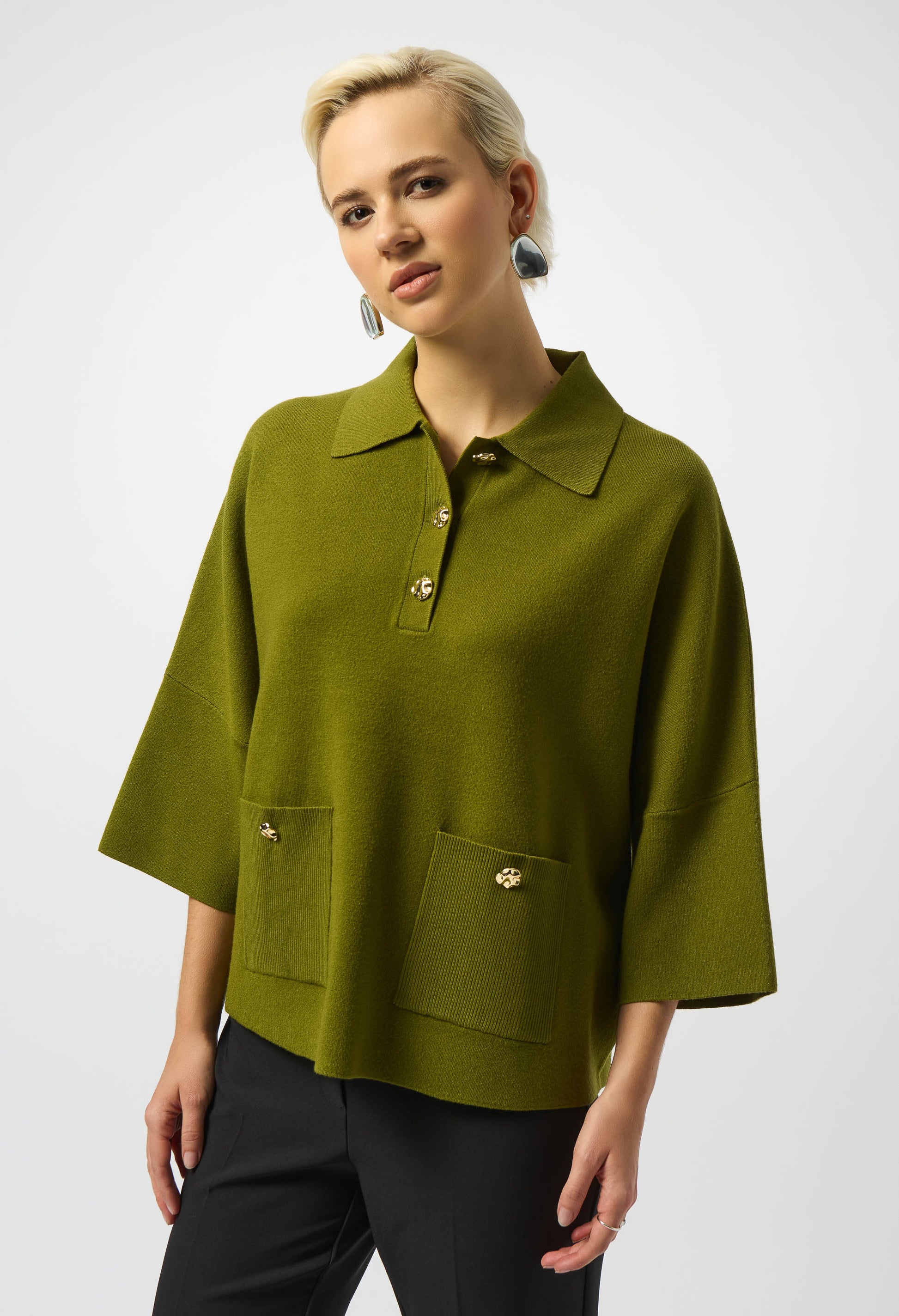 Woman wearing a green blouse with a white background
