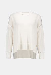 White sweater on a light gray background