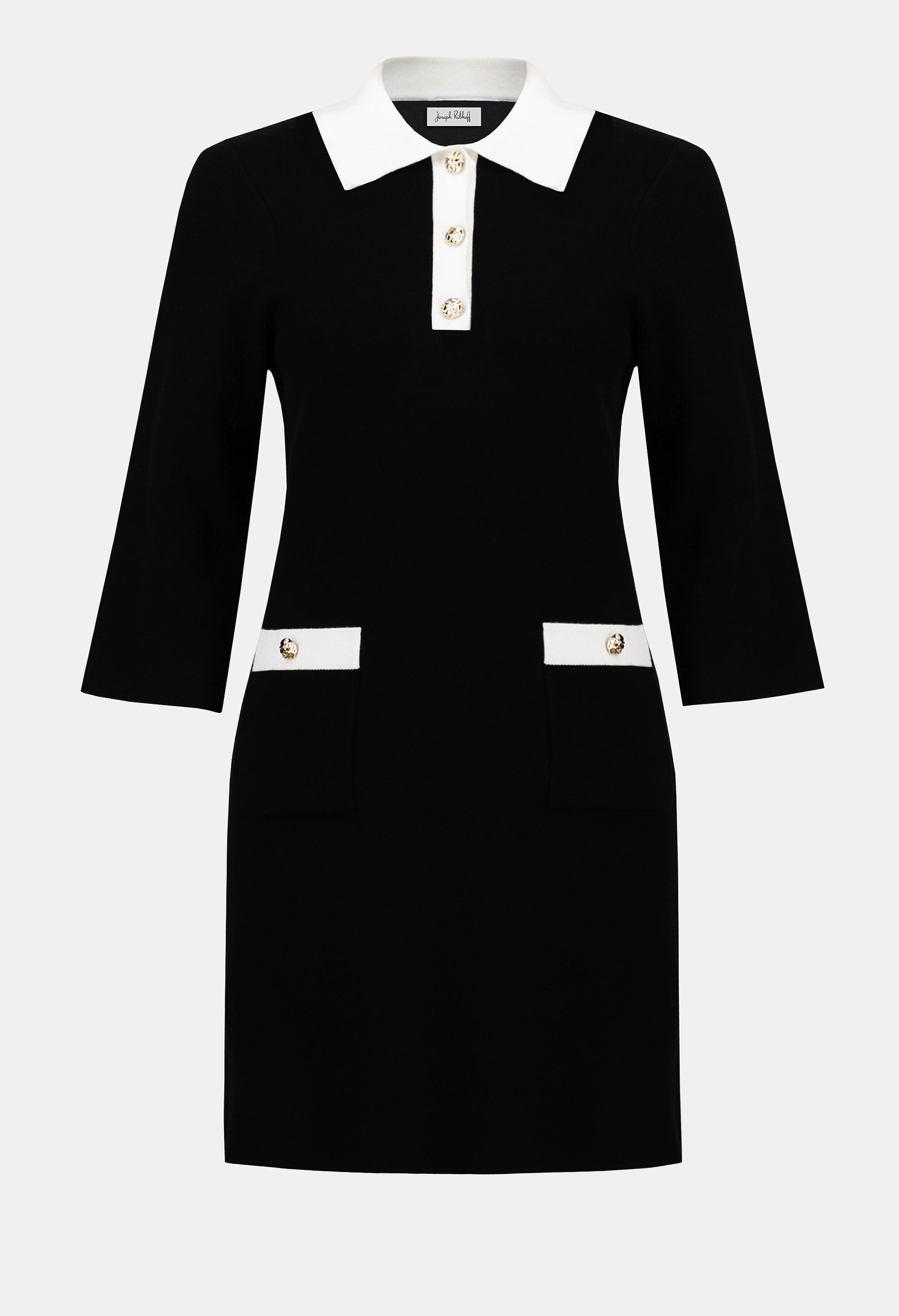 Black dress with white collar and buttons on a white background