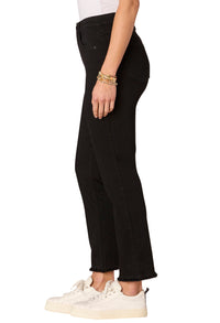 Person wearing black pants and white sneakers on a white background