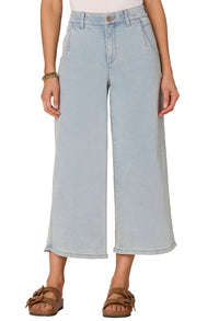 Light blue jeans worn by a person on a white background