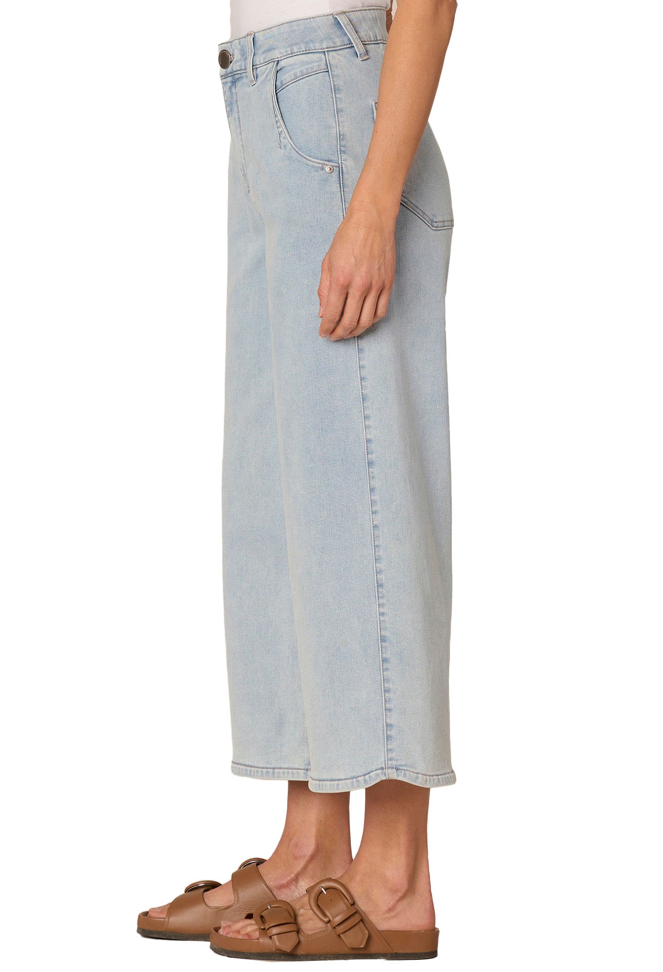 Light blue denim skirt worn by a person on a white background