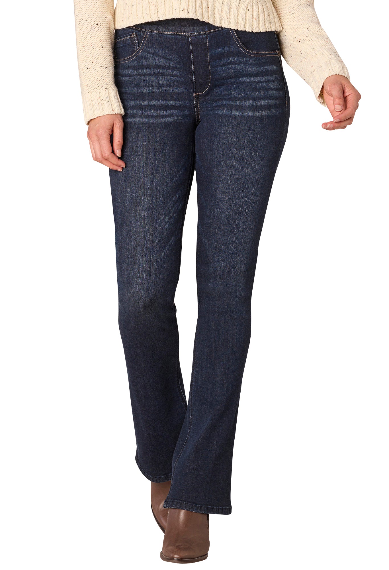 Dark blue jeans worn by a person on a white background