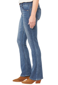 Blue jeans worn by a person on a white background