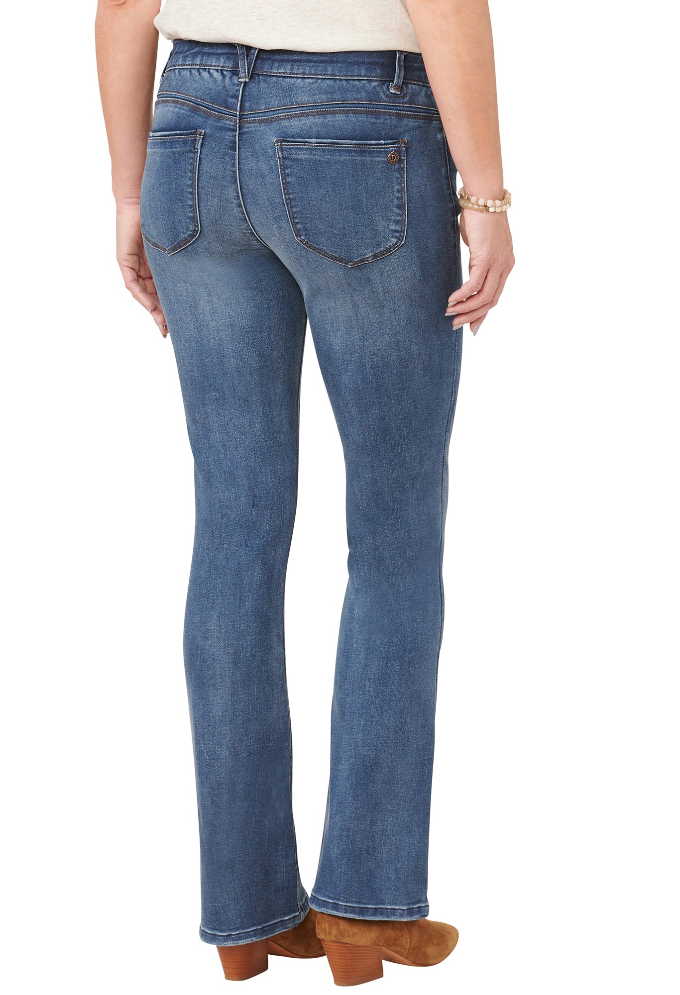 Blue jeans worn by a person on a white background