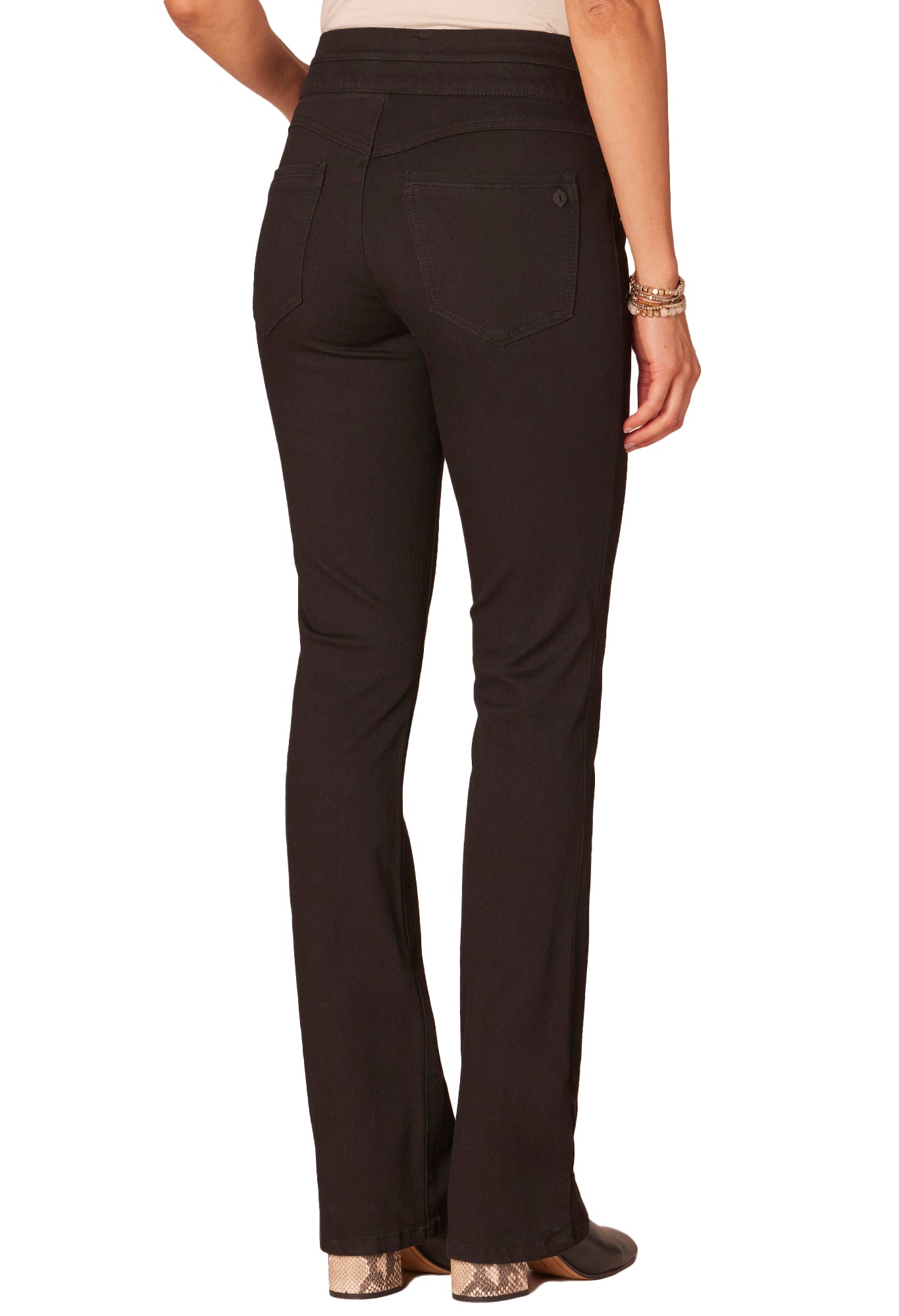 Dark brown pants worn by a person on a white background