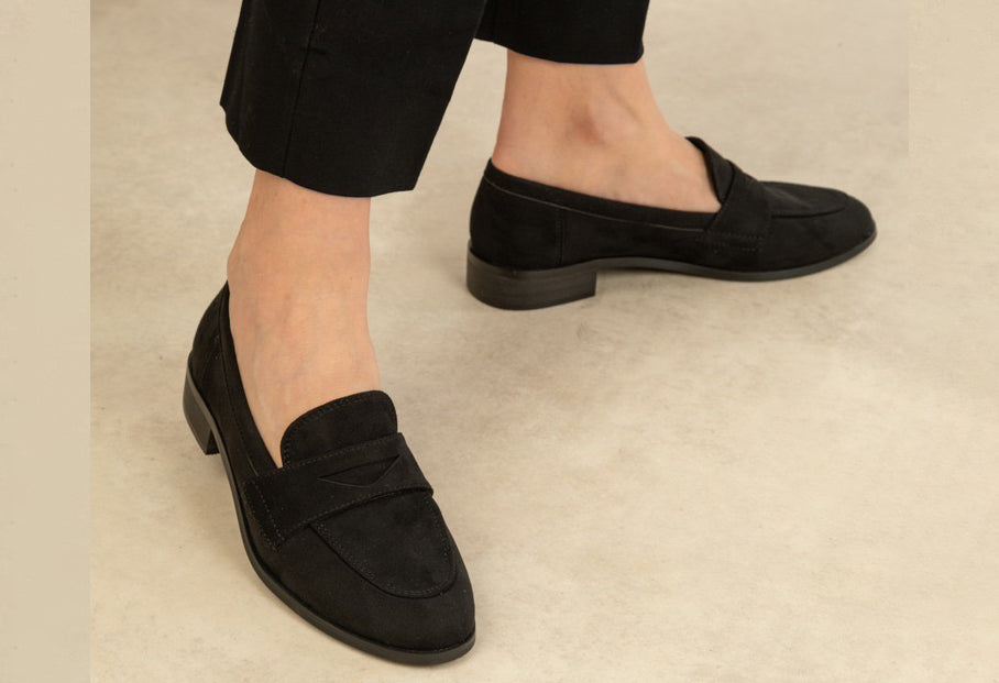 black loafer on the foot