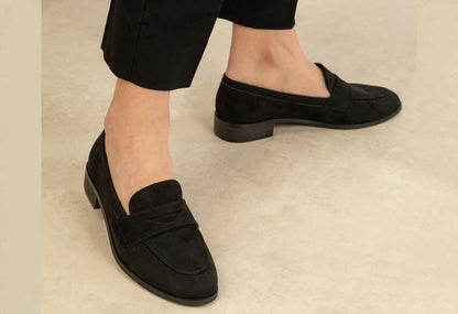 black loafer on the foot