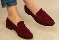 wine coloured loafer on the foot