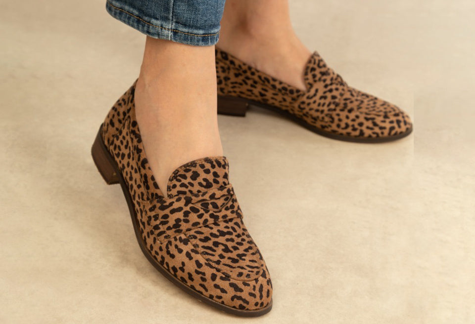 leopard print loafer on the foot