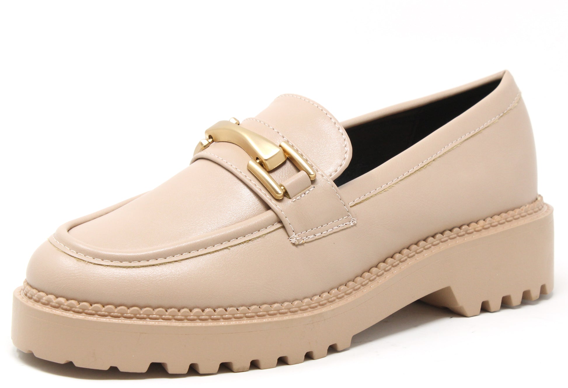 Beige loafer shoe with gold buckle on a white background