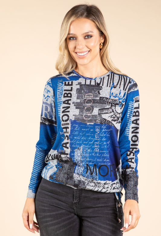 model in blue and grey top on beige background