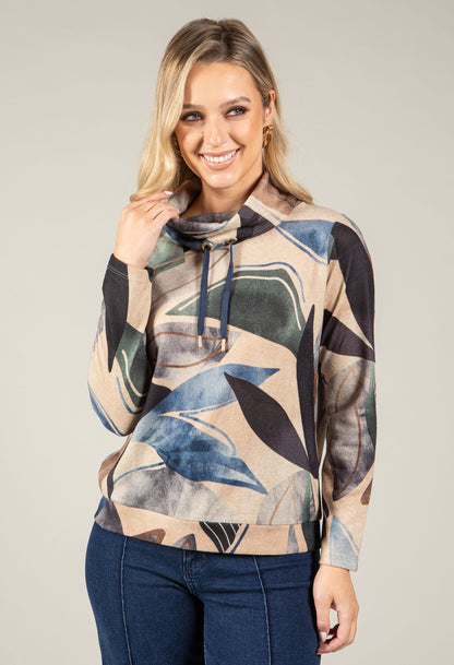 Woman wearing a patterned hoodie with a neutral background