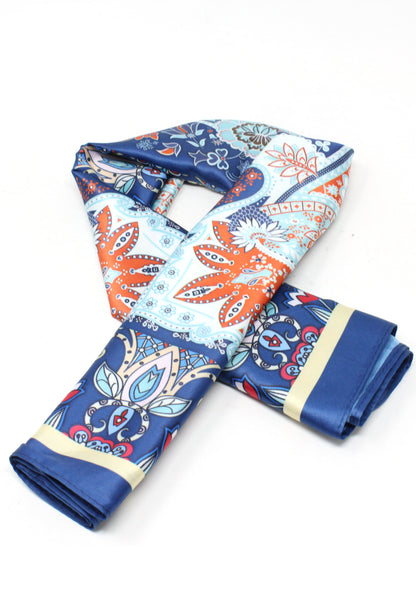 Folded fabric with blue and orange pattern on a white background