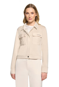 Woman wearing a beige jacket on a white background