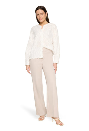Lace blouse with decorative hem