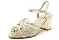 Gold sandal with a strap on a white background