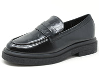Black leather loafer shoe on a white background