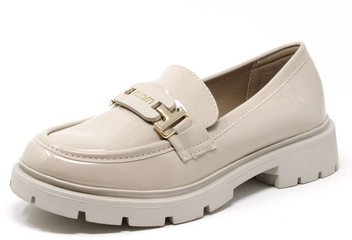 Beige loafer shoe with gold buckle on a white background