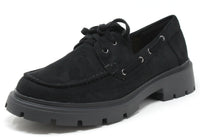 Black suede shoe with a thick sole on a white background