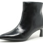 Black patent leather ankle boot on a white background