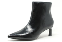 Black patent leather ankle boot on a white background