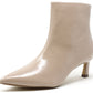 Beige ankle boot with a pointed toe on a white background