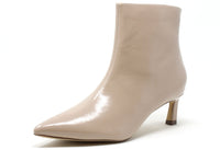 Beige ankle boot with a pointed toe on a white background