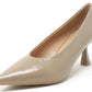Beige high-heeled shoe on a white background