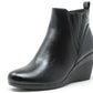Black wedge ankle boot on a white background