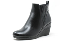 Black wedge ankle boot on a white background