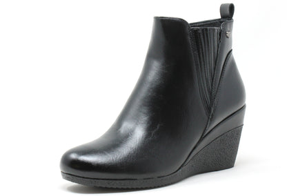 Black wedge ankle boot on a white background