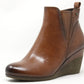 Brown wedge ankle boot on a white background