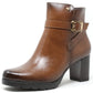 Brown ankle boot with a gold buckle on a white background