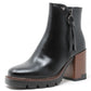 Black leather ankle boot with a brown block heel on a white background